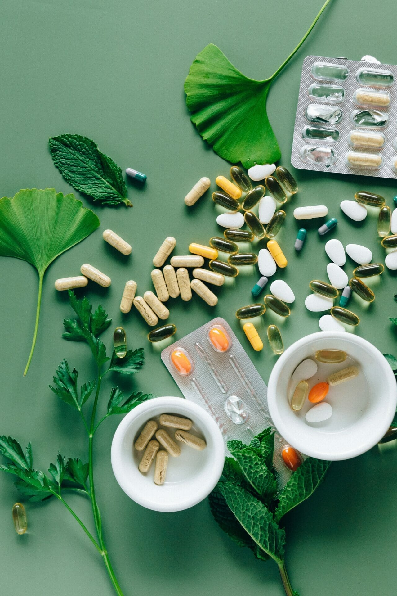 A photo of tablets on a table with leaves